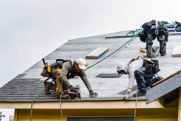 Professional Roof Replacement technician working in North Clarendon, VT